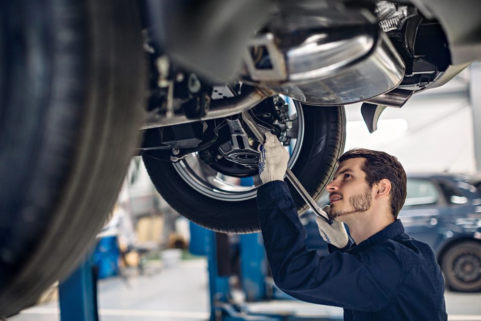 ASE certified technician working on vehicle