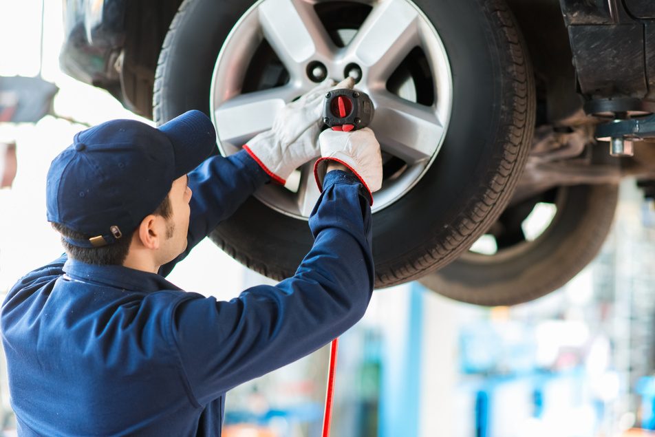 ASE certified mechanic at custom complete automotive servicing vehicle