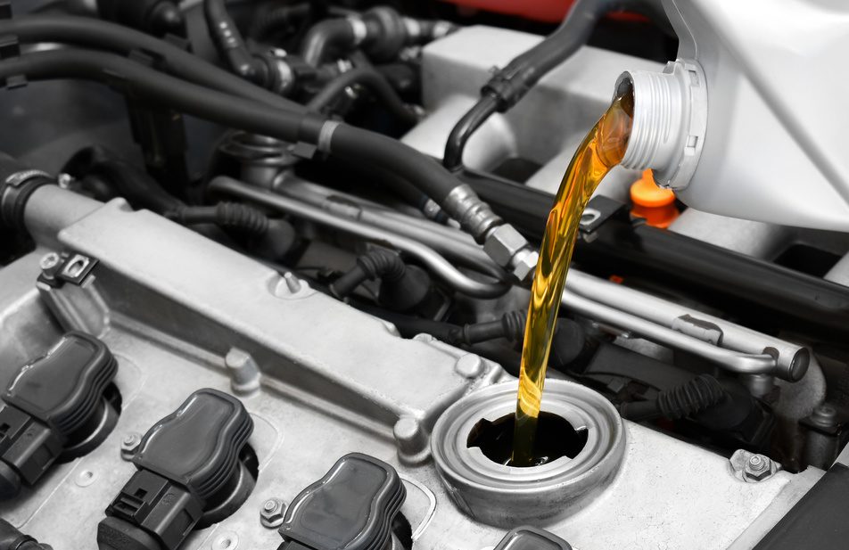 mechanic using synthetic oil during car oil change
