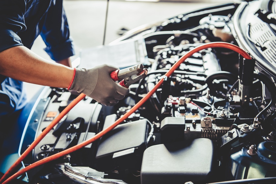 mechanic repairing car's electrical system