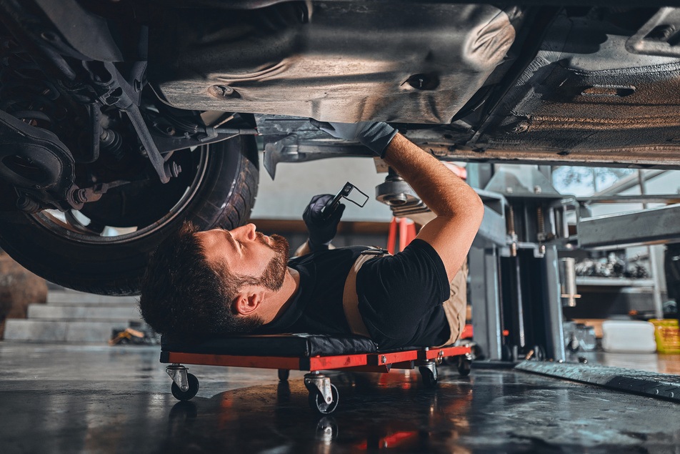 professional mechanic working on car