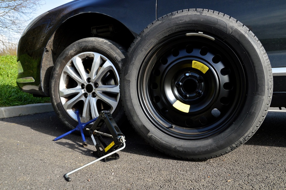installing spare tire on vehicle