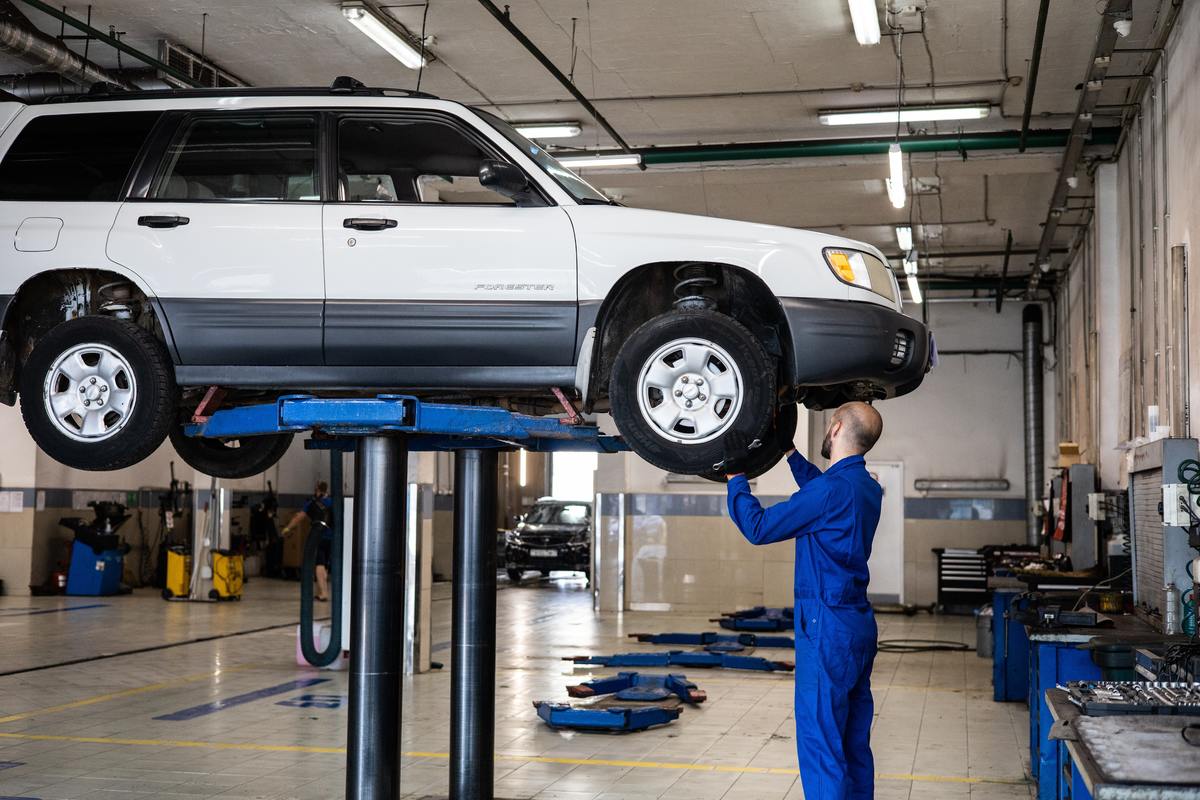 certified mechanic making car repairs