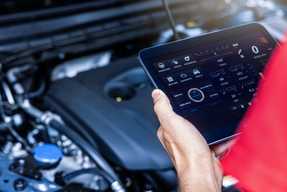 mechanic checking engine diagnostics