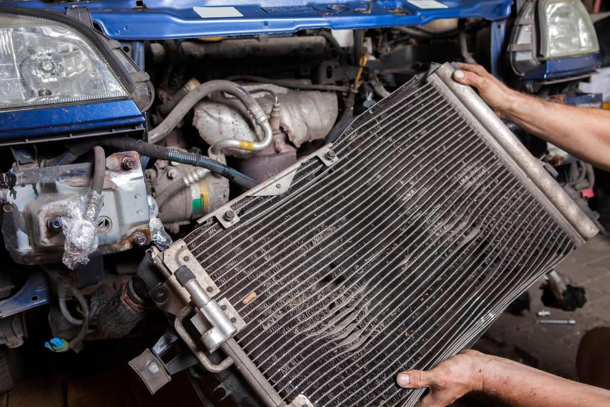 worn radiator taken out of vehicle