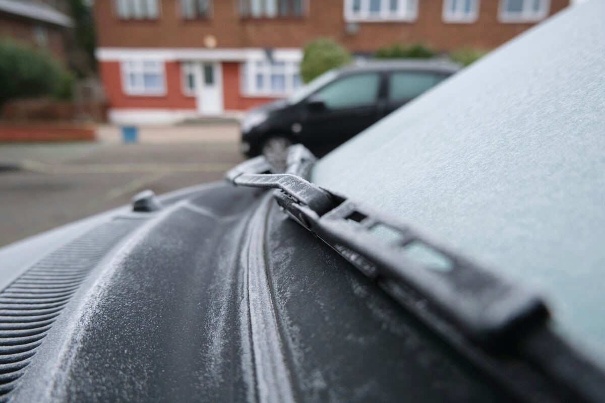 windshield wipers covered in frost